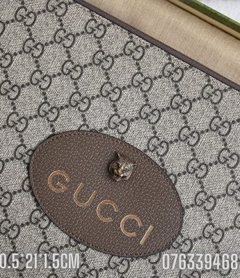 Vi nu Gucci cam tay logo mau nau hoa tiet chu NGC22 2